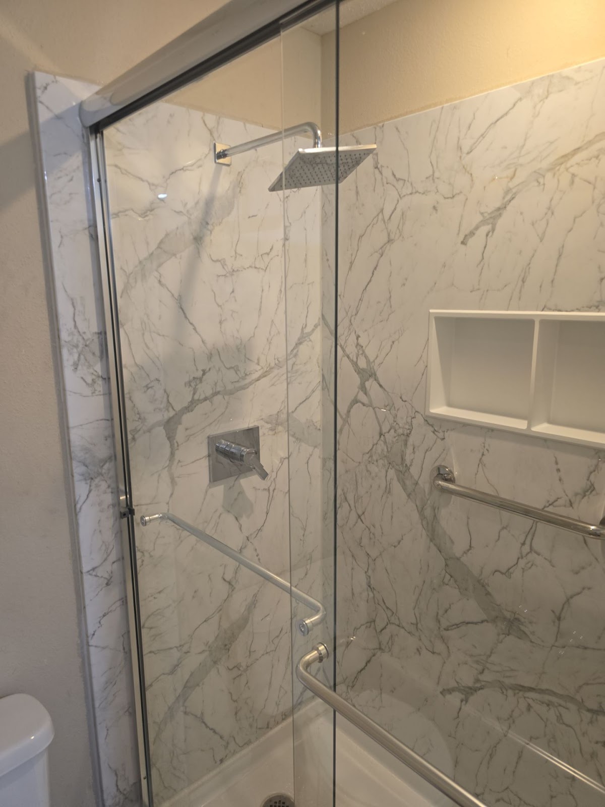Marble shower remodel by Jorge